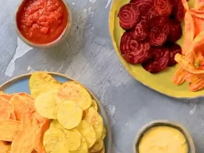 Vegetable chips with tomato dip and cheddar sauce